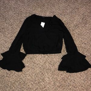 Cropped long sleeve black top